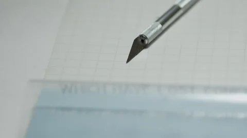 Knife (scalpel) lying on the table picked by a hand Video stock 271561117