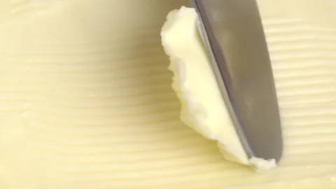 Knife scoops butter, close-up. Stock Footage 278471393