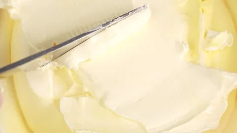 Knife scoops butter, close up. Stock Footage 303631828