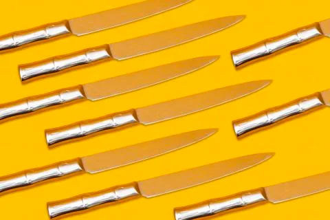 Knife seamless pattern on yellow background, cutting concept Stock Photos