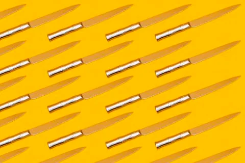 Knife seamless pattern on yellow background, cutting concept Stock Photos
