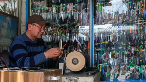 Knife sharpening process Stock Photos