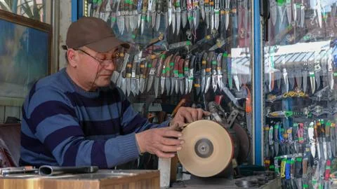 Knife sharpening process Stock Photos