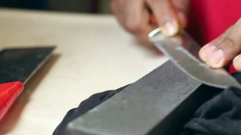 Knife sharpening with stone, manual blade sharpening Stock Footage 136436562