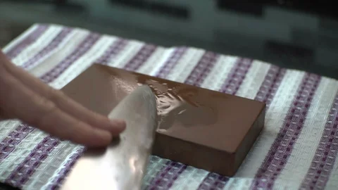 Knife Sharpening on Wet Whetstone , close up close up chef chefs knife Stock Footage 129428864