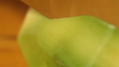 The knife slices avocado slices.Macro.close-up Stock Footage 115479400