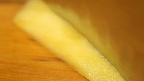 The knife slices mango slices.Macro.close-up Stock Footage 115479793