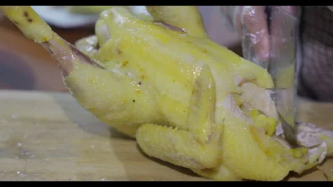 Knife slicing cooked chicken head, close-up, no face 스톡 동영상 329684661