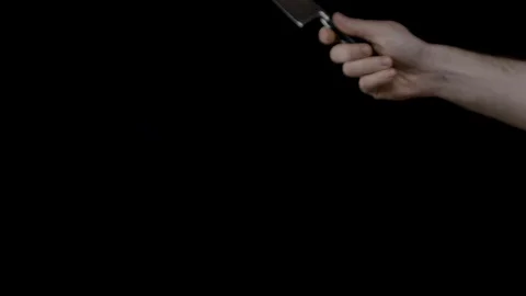 A knife slicing a falling strawberry in half Stock Footage 128694201