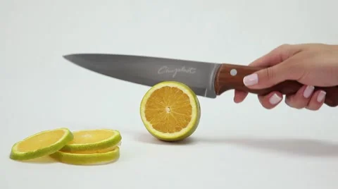 Knife slicing a orange. Stock Footage 46530849