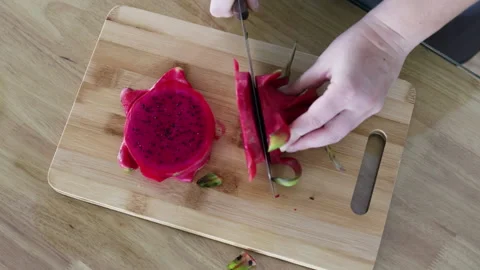 Knife slicing red dragon top view. Stock-Footage 292217800
