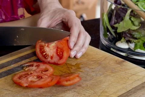 Knife slicing tomato 스톡 사진