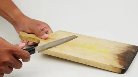 Knife Striking a Cutting Board Stock Footage 327849319