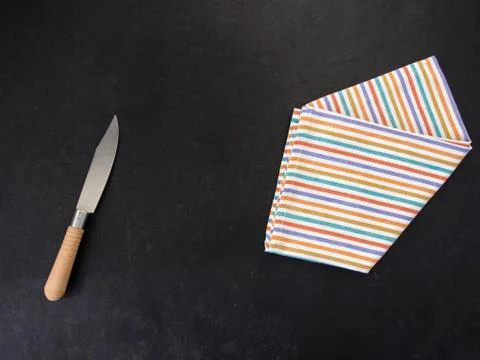 Knife on a tea towel Stock Photos