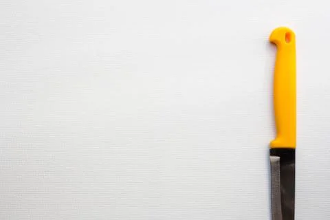 Knife with a yellow handle Stock Photos