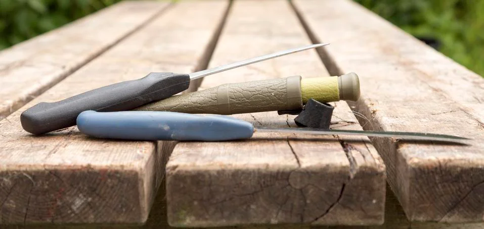 Knifes Lying on Table Stock Photos