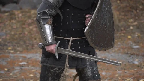 A knight carries a shield and a sword in his hands Stock Footage 81672014