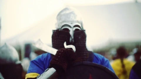 Knight preparing for war. Close-up on eyes and helmet Stock Footage 101652452