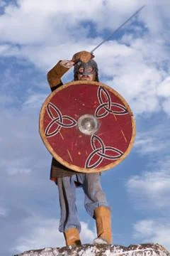 Knight on a rock with  sword Stock Photos
