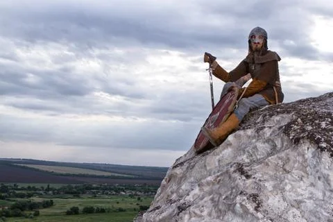Knight sitting on a rock Stock Photos