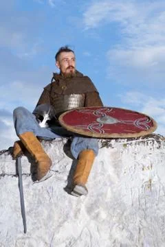 Knight sitting on a rock Stock Photos
