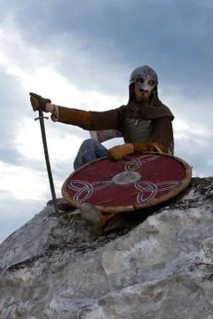 Knight sitting on a rock Stock Photos