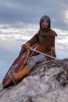 Knight sitting on a rock Stock Photos