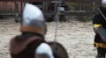 Knight tournament. Two medieval opponents and referee are on the battlefield HD Footage