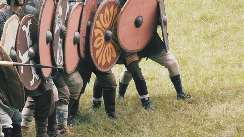 Knight warriors marching forward, shield wall. Medieval soldiers in full armor Stock Footage 112866568