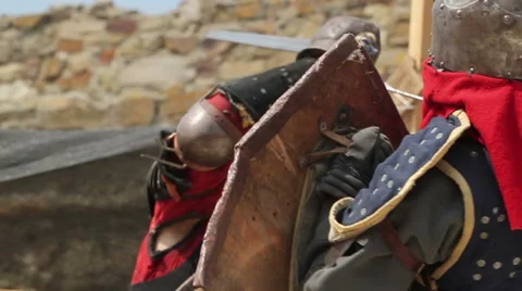 Knights in armor fighting with swords Stock Footage 53278188