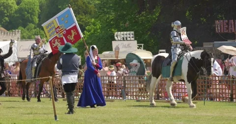 Knights parade with medieval banners during Queen's Joust Stock-Footage 338419212