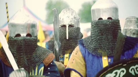 Knights preparing for war. Close-up on eyes and helmets Stock Footage 101652122