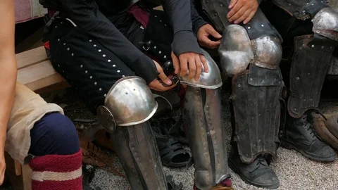 Knights put on their armor Stock Footage 123583765