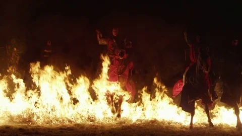 Knights riding through Fire Stock Footage 70140438