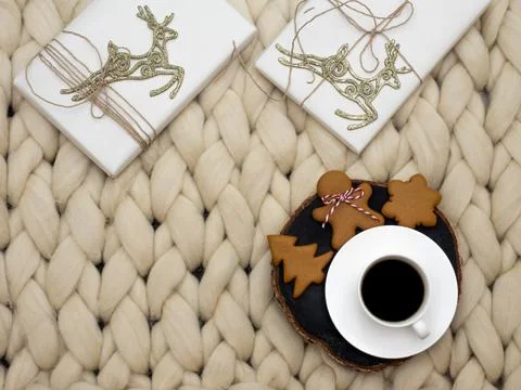 Knit background. Cup of coffee and ginger cookies. Christmas concept. Stock Photos