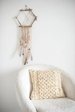 Knit cushion in the interior Stock Photos