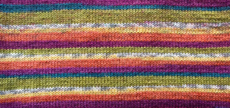 Knit pattern.Close-up. Colored textured background. Stock Photos