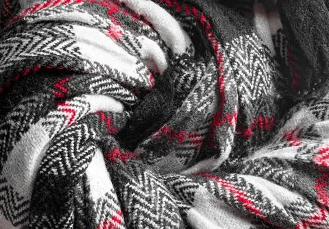 Knit texture of natural soft wool knitted fabric black white red background Stock Photos