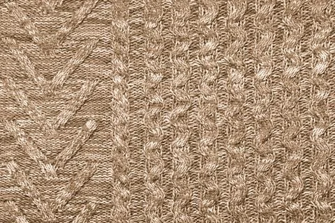 Knit texture of natural soft wool knitted fabric brown melange background Stock Photos