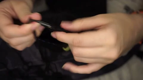 Knits black wool with knitting needles Video stock 168802137