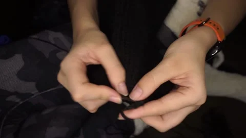Knits black wool with knitting needles Video stock 169629310