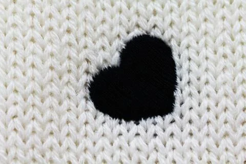 Knitted background with heart Stock Photos