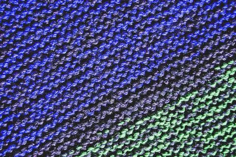 Knitted background pattern in deep blue and green colors Stock Photos