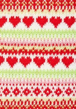 Knitted background with a pattern in the shape of heart Foto stock