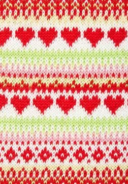 Knitted background with a pattern in the shape of heart knitted background... Stock Photos