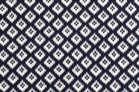Knitted background in rhombus Stock Photos