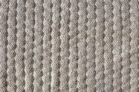 Knitted beige background Stock Photos