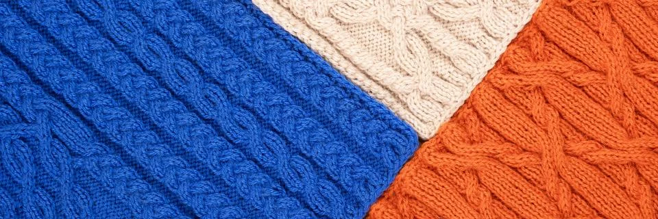 Knitted blue orange and beige background Stock Photos