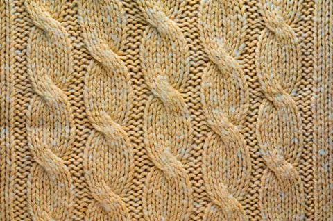 Knitted Cloth Texture with Cable Knits Pattern Stock Photos