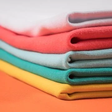 Knitted fabrics in assortment Stock Photos